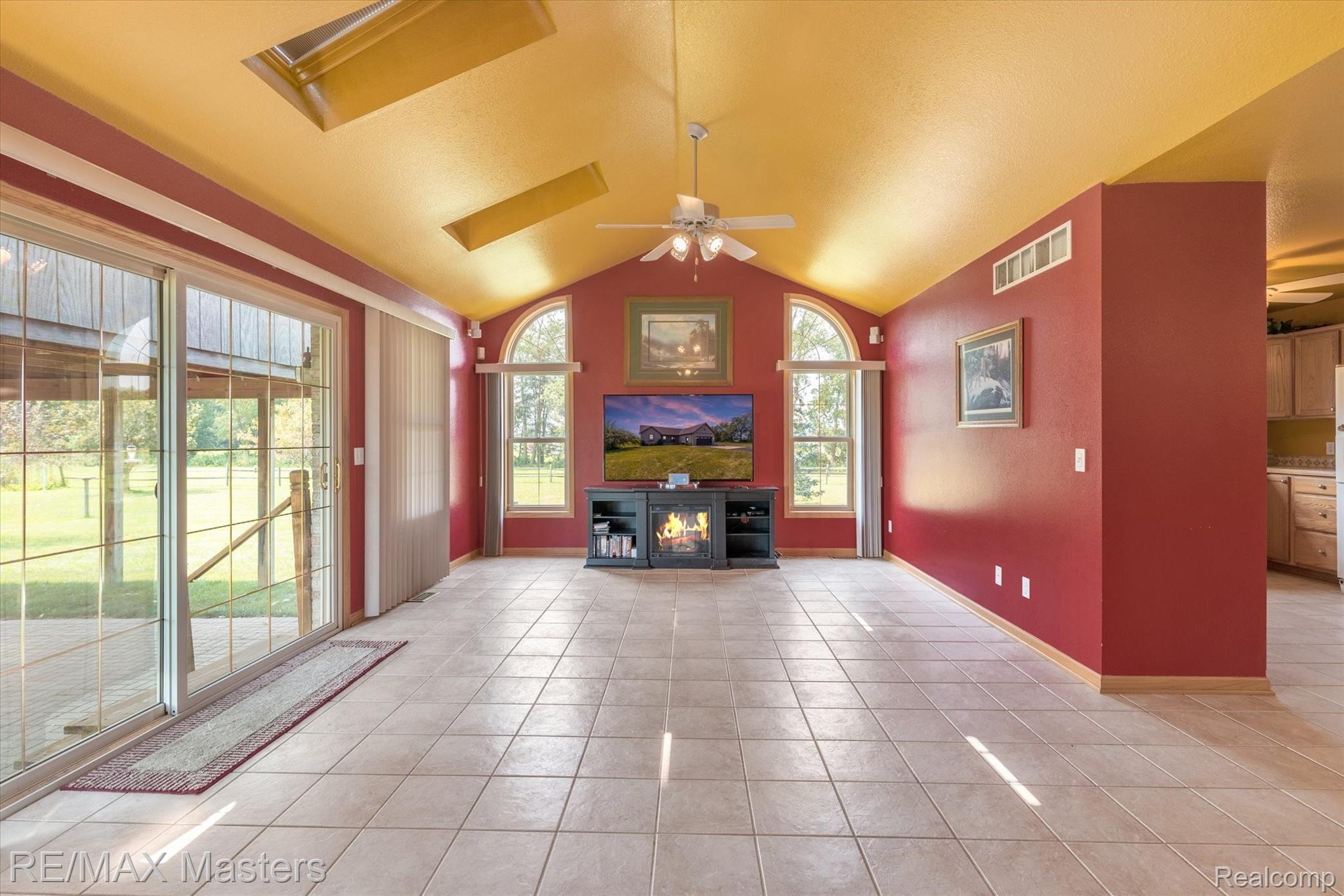 Living Room With Vaulted Ceiling, Sunlights And Lg Windows