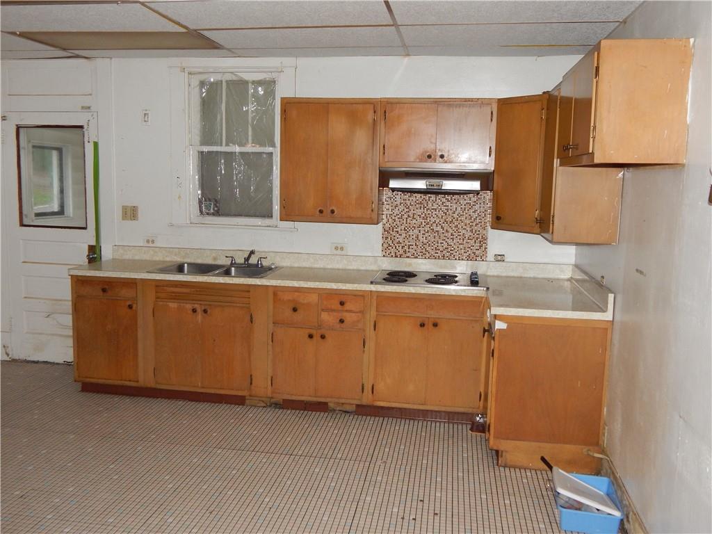 398 Evans City Road Butler, PA 16001 - Photo 8 of 19 a kitchen with sink a microwave and cabinets