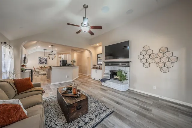a bathroom with double vanity sink a mirror and a shower