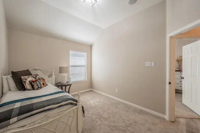 a bedroom with a bed and a cabinets