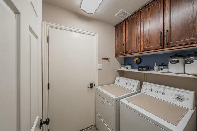 a view of a house with backyard porch and sitting area