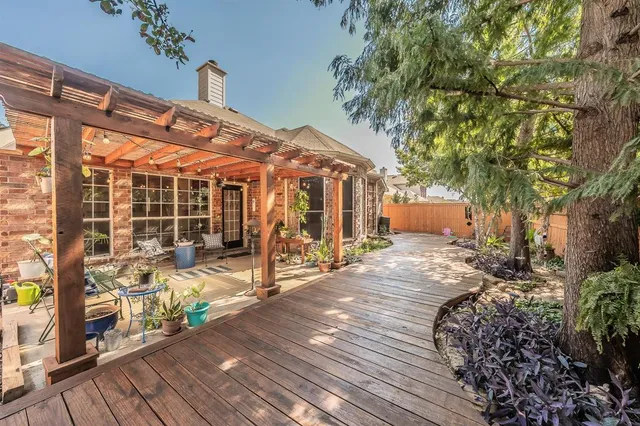 a patio with water fountain and outdoor seating