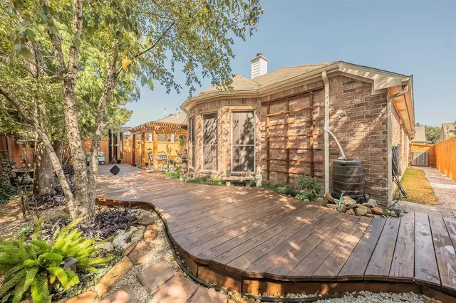 an aerial view of a house a swimming pool yard and lake view