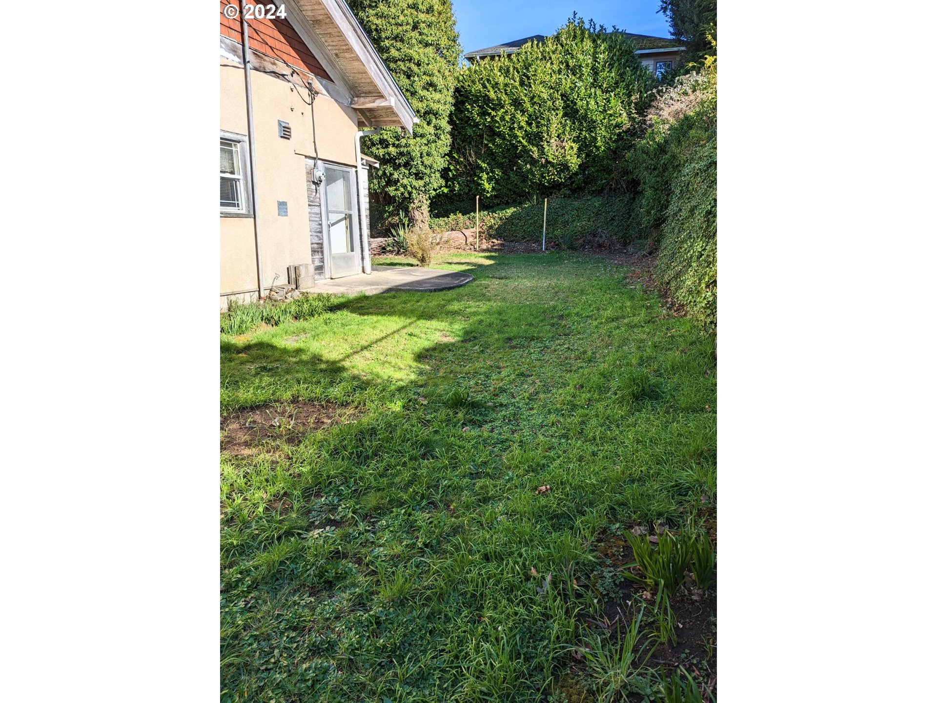 150 North Dean Street Coquille, OR 97423 - Photo 12 of 47 a view of a house with a backyard