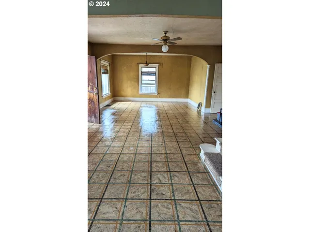 a kitchen with stainless steel appliances granite countertop a stove a sink dishwasher and a refrigerator