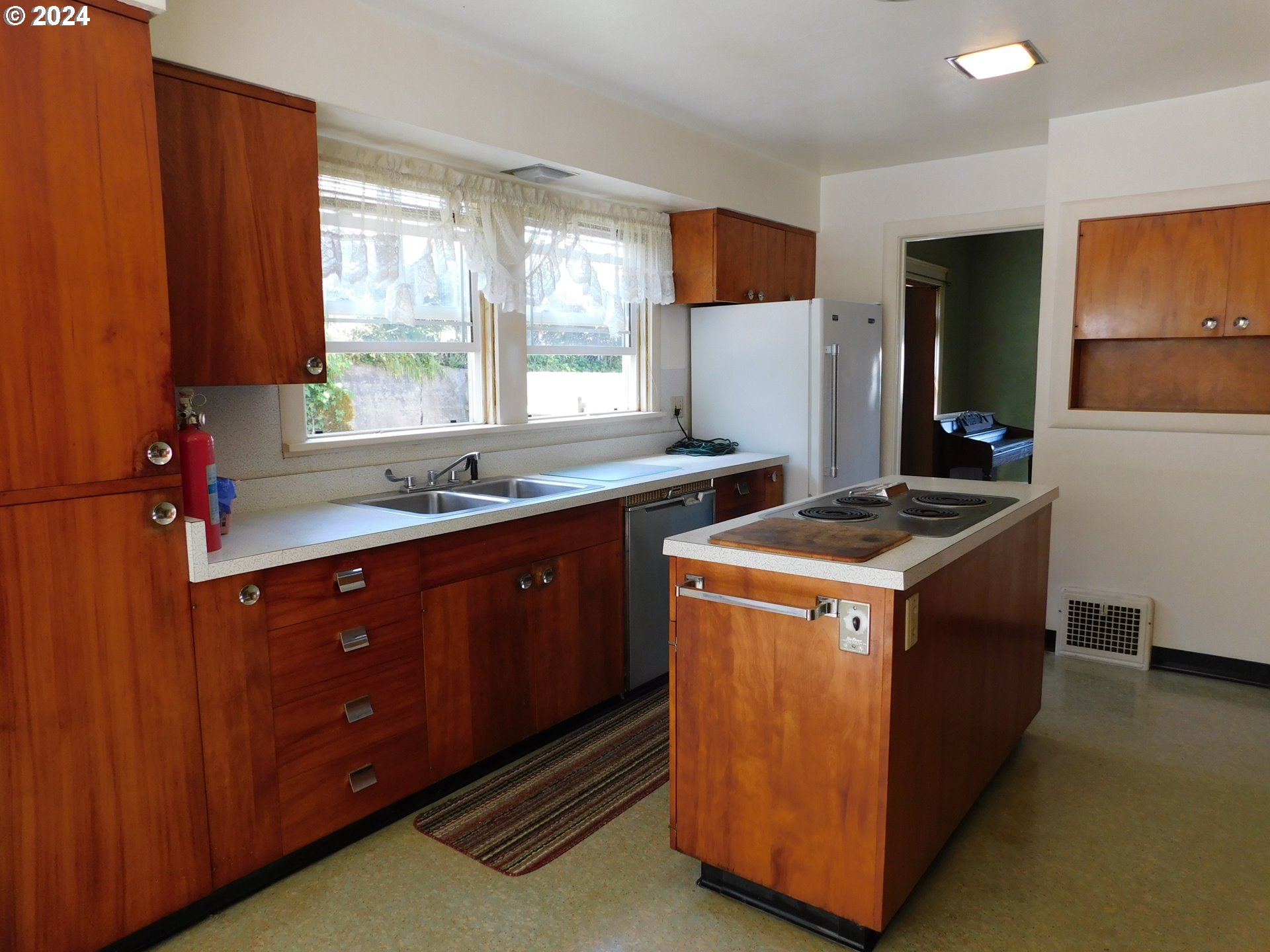 150 North Dean Street Coquille, OR 97423 - Photo 19 of 47 a kitchen with stainless steel appliances granite countertop a stove a refrigerator and a sink