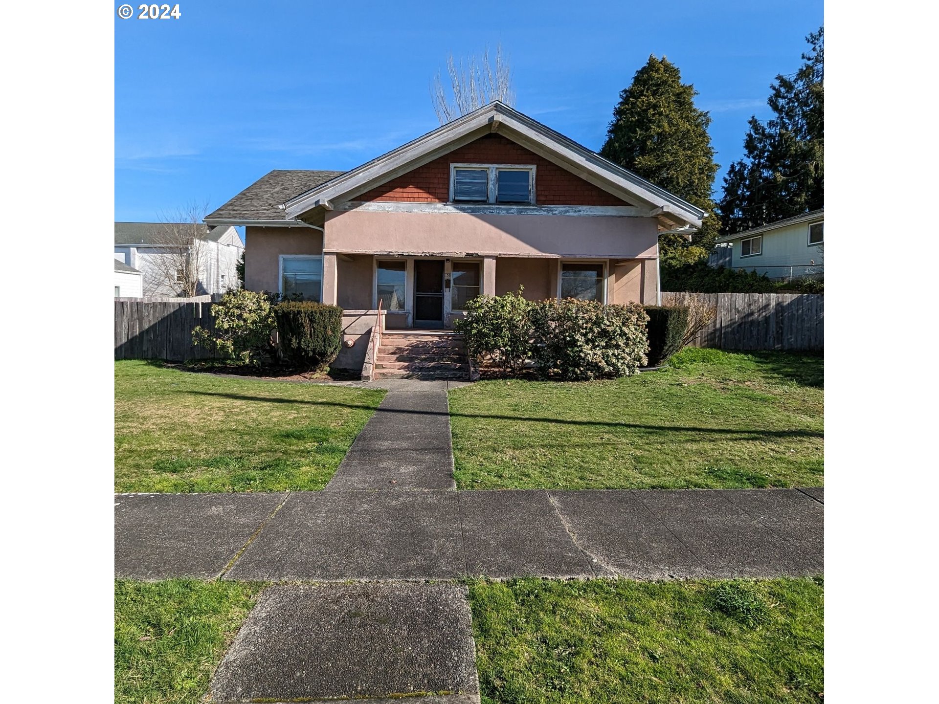 150 North Dean Street Coquille, OR 97423 - Photo 2 of 47 a front view of a house with a yard