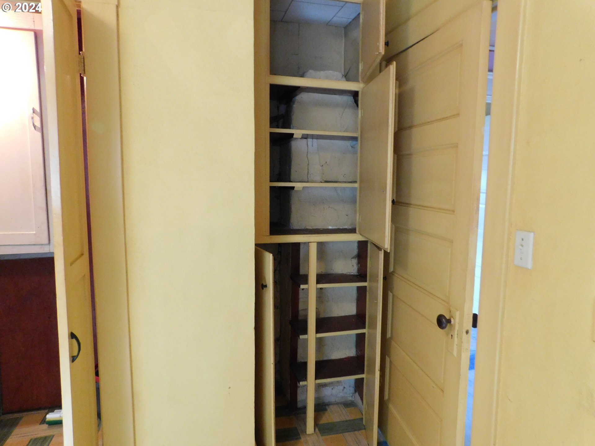150 North Dean Street Coquille, OR 97423 - Photo 27 of 47 a view of walk in closet with empty racks