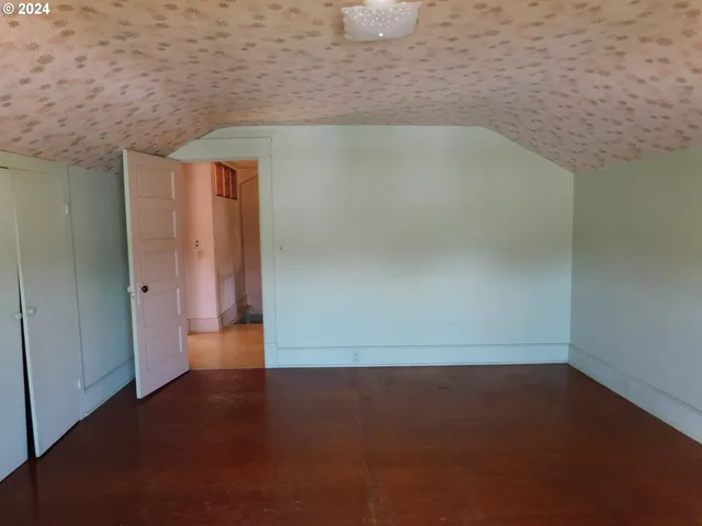 a bathroom with a bathtub and a toilet