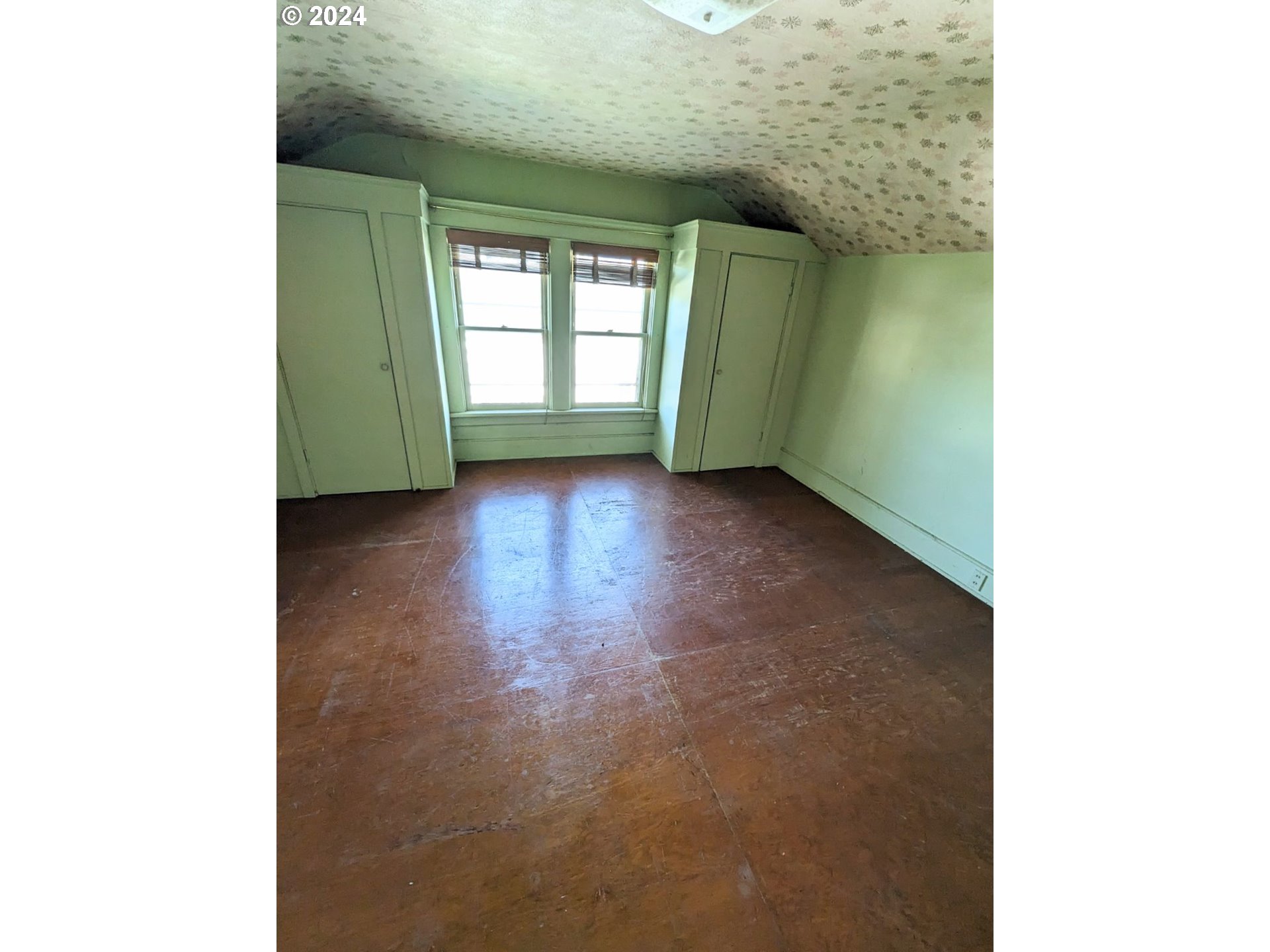 150 North Dean Street Coquille, OR 97423 - Photo 35 of 47 a view of an empty room with a fireplace and a window