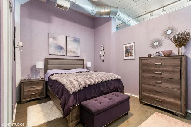 a bedroom with a bed and furniture