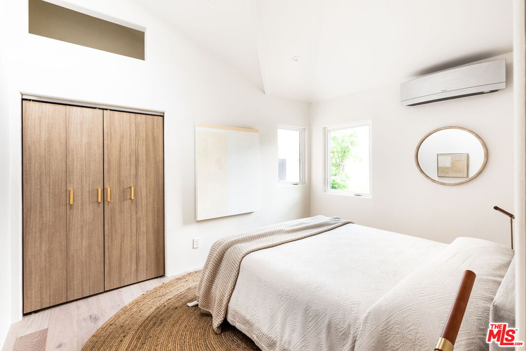 857 Rose Avenue Venice, CA 90291 - Photo 19 of 32 a bedroom with a bed and a window