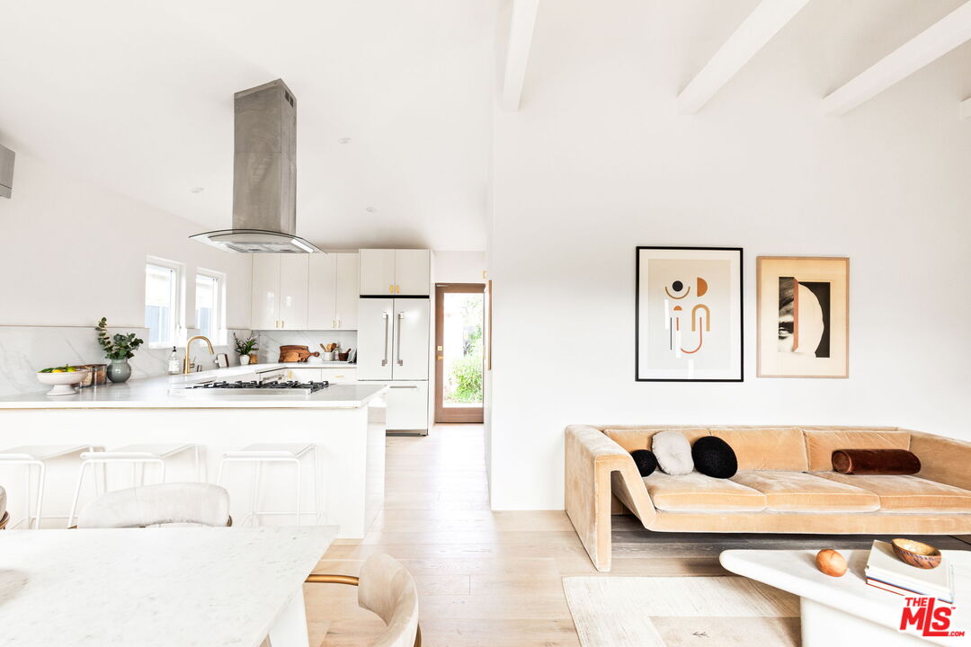 857 Rose Avenue Venice, CA 90291 - Photo 8 of 32 a kitchen with stainless steel appliances kitchen island a stove a sink and a refrigerator