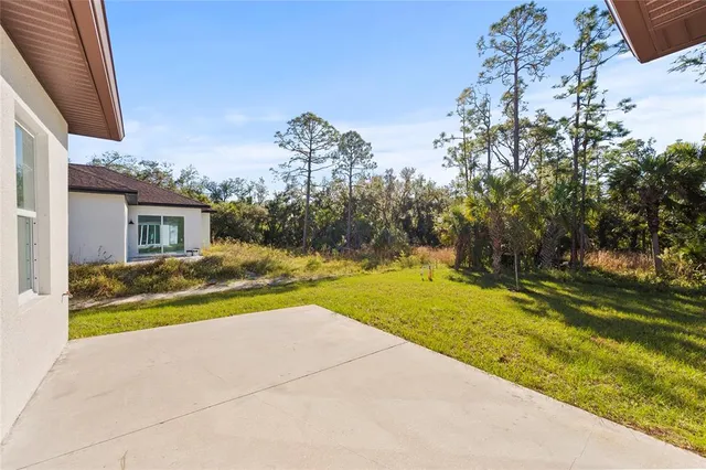 a view of house with outdoor space and seating area