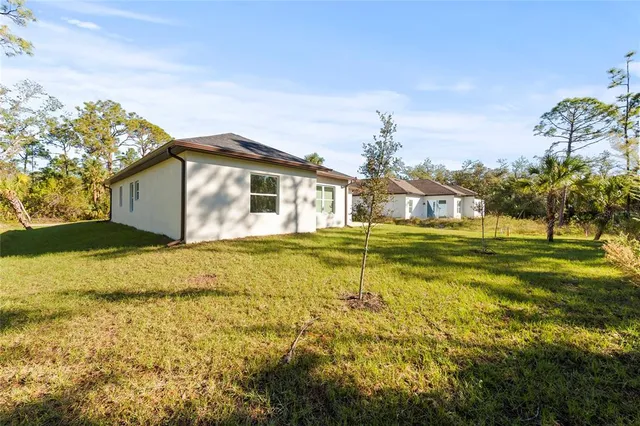 a view of a house with a big yard