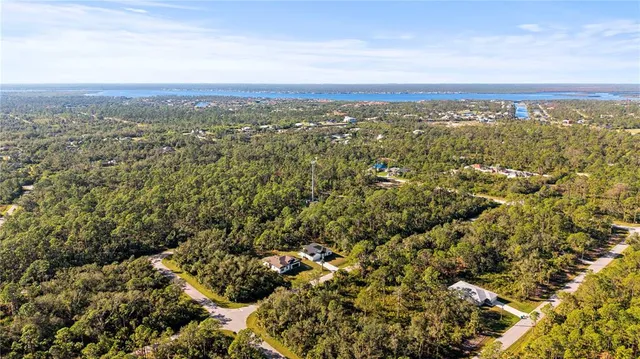 an aerial view of residential building and green space