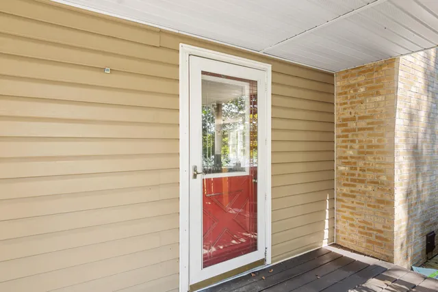 a balcony with wooden floor