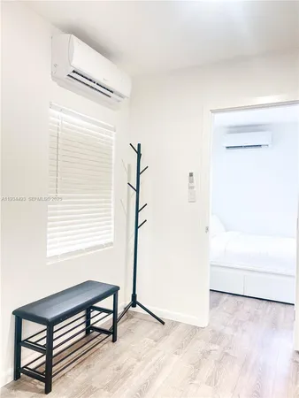 a view of a room with cabinet and a window