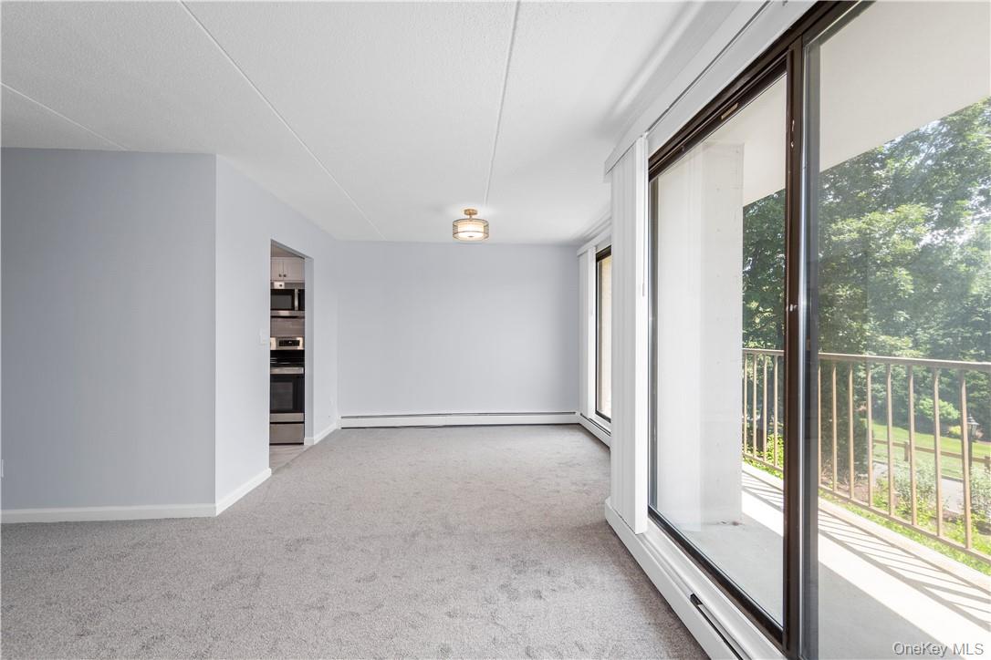 150 Overlook Avenue, Unit 1S Peekskill, NY 10566 - Photo 13 of 23 an empty room with windows
