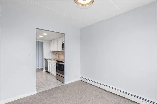 a view of kitchen with sink and microwave