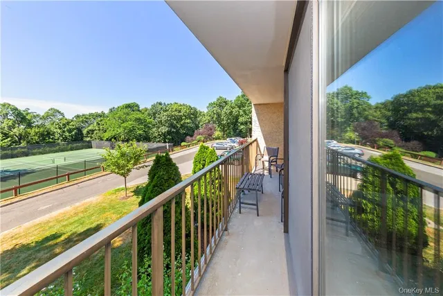 a view of a balcony with chairs