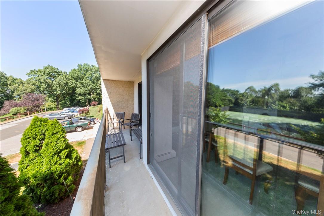 150 Overlook Avenue, Unit 1S Peekskill, NY 10566 - Photo 19 of 23 a view of a balcony with lake view and a potted plant