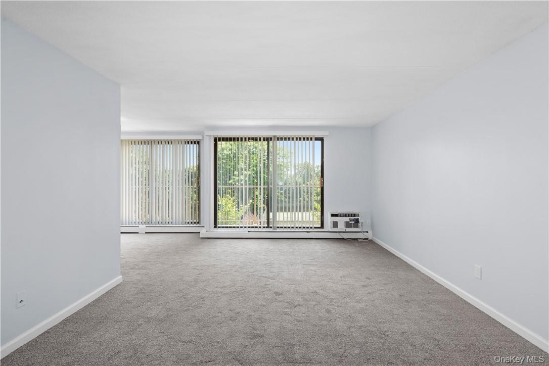 150 Overlook Avenue, Unit 1S Peekskill, NY 10566 - Photo 4 of 23 a view of an empty room with a window