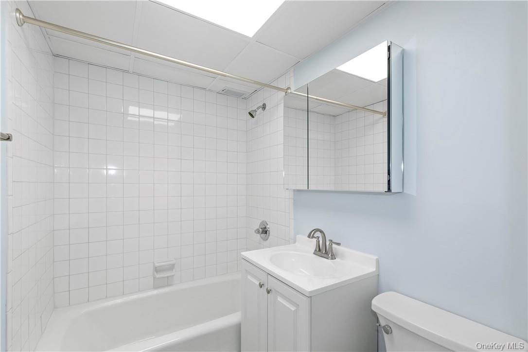 150 Overlook Avenue, Unit 1S Peekskill, NY 10566 - Photo 9 of 23 a bathroom with a sink a toilet and shower