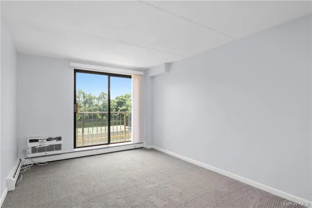 an empty room with a empty space and a window