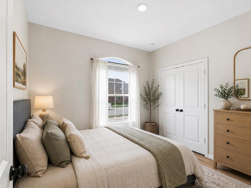16936 Post Cedar Drive Justin, TX 76247 - Photo 18 of 30 Virtually Staged Bedroom with light-toned walls and wood-finish flooring