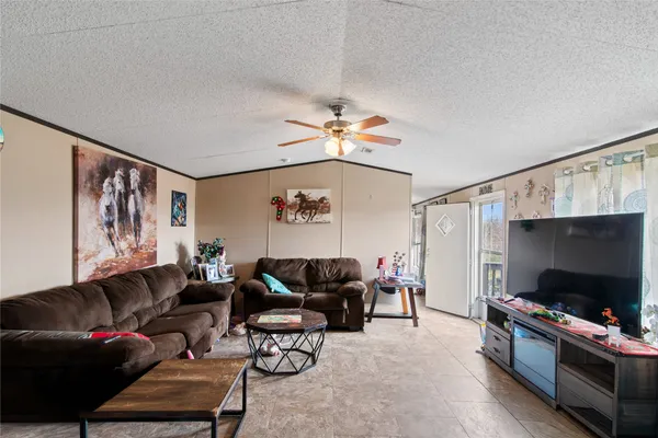a kitchen with refrigerator and cabinets