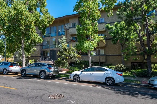 a view of a cars parked in front of a house