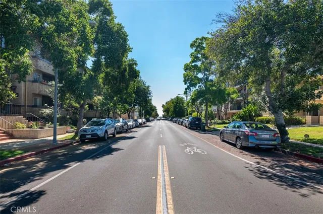 a view of a street with cars