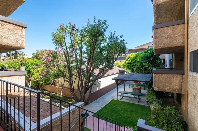 a house view with a sitting space and garden