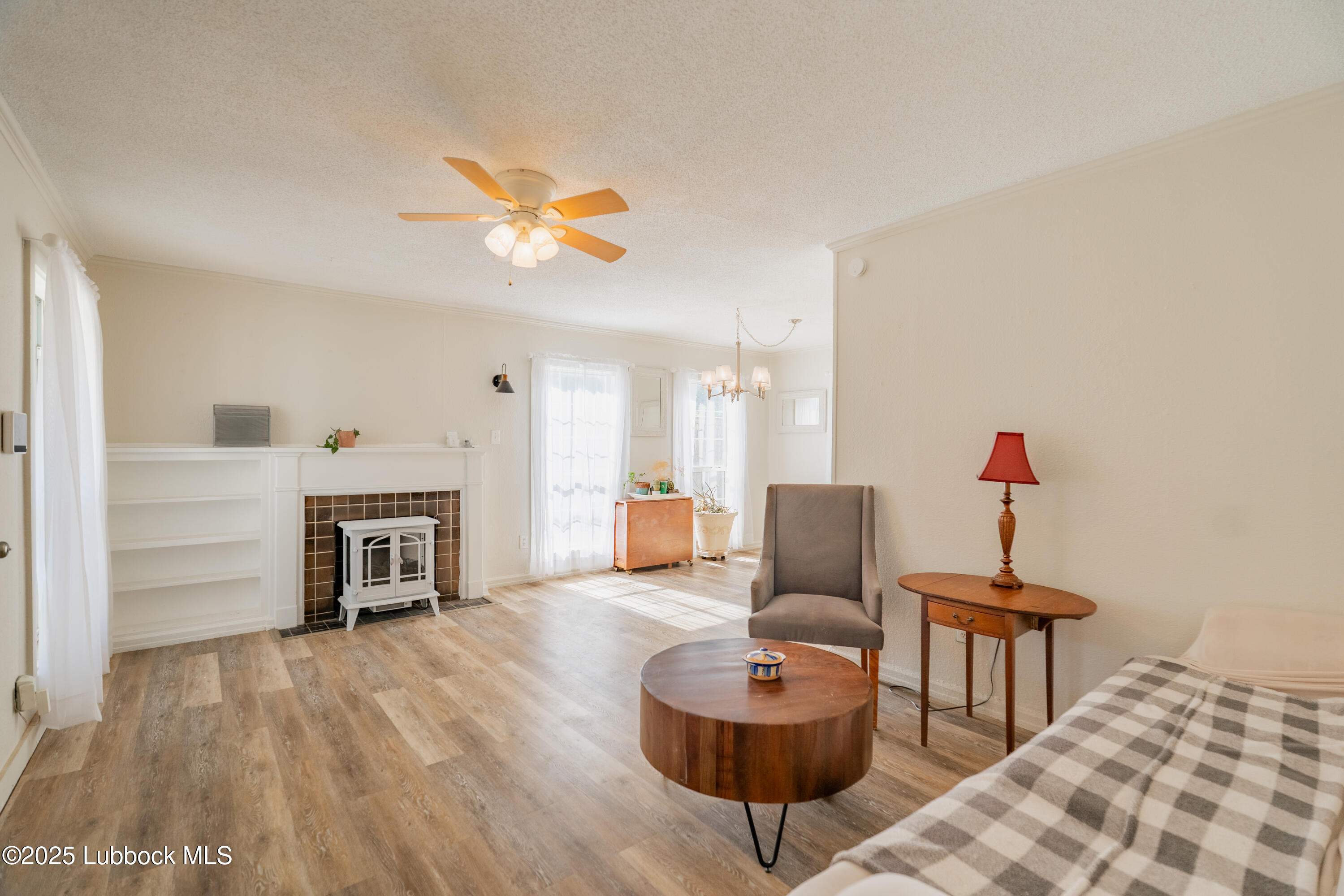 2012 29th Street Lubbock, TX 79411 - Photo 14 of 27 a living room with furniture and a fireplace
