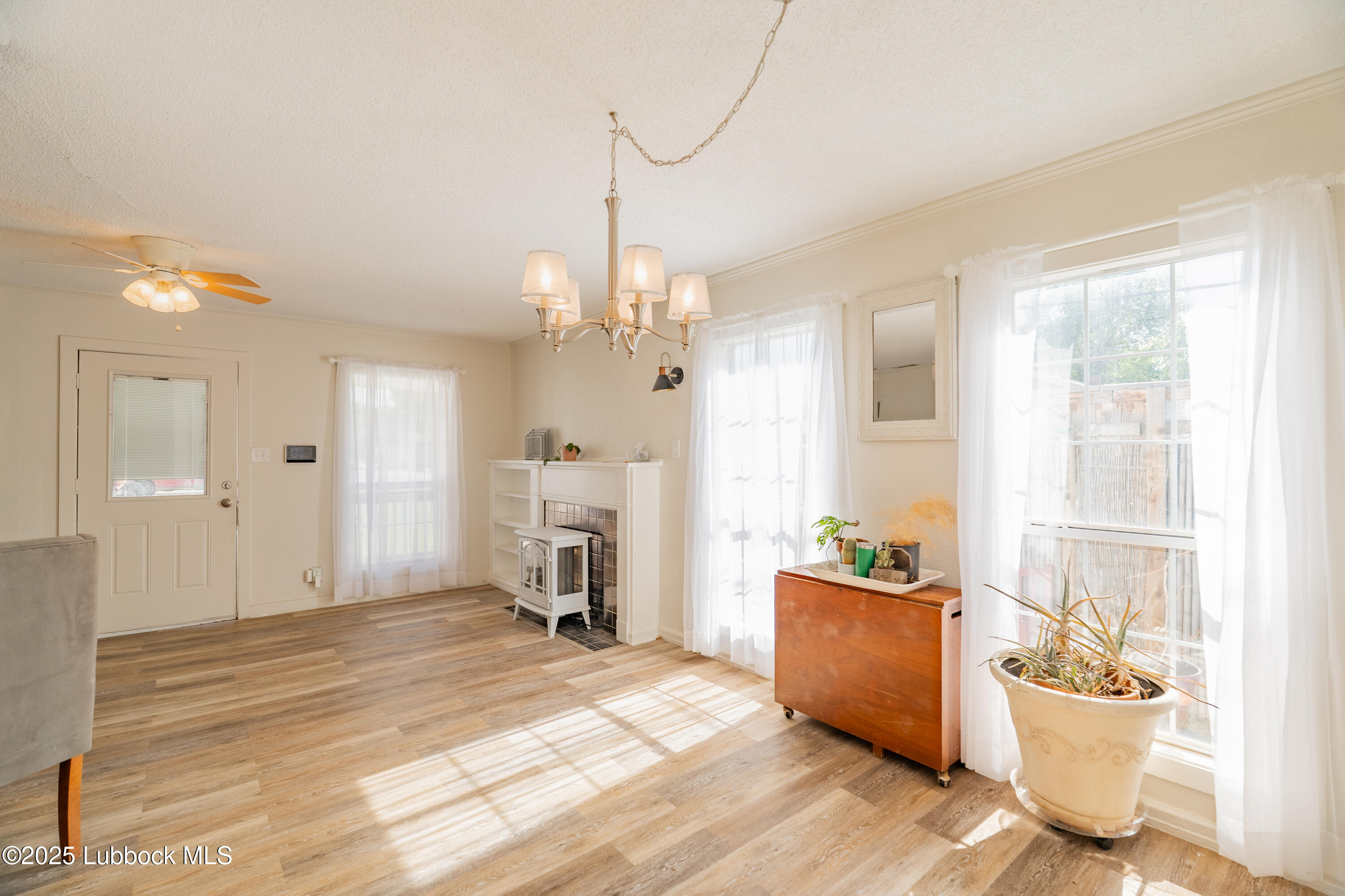 2012 29th Street Lubbock, TX 79411 - Photo 16 of 27 a view of a room with a window and wooden floor
