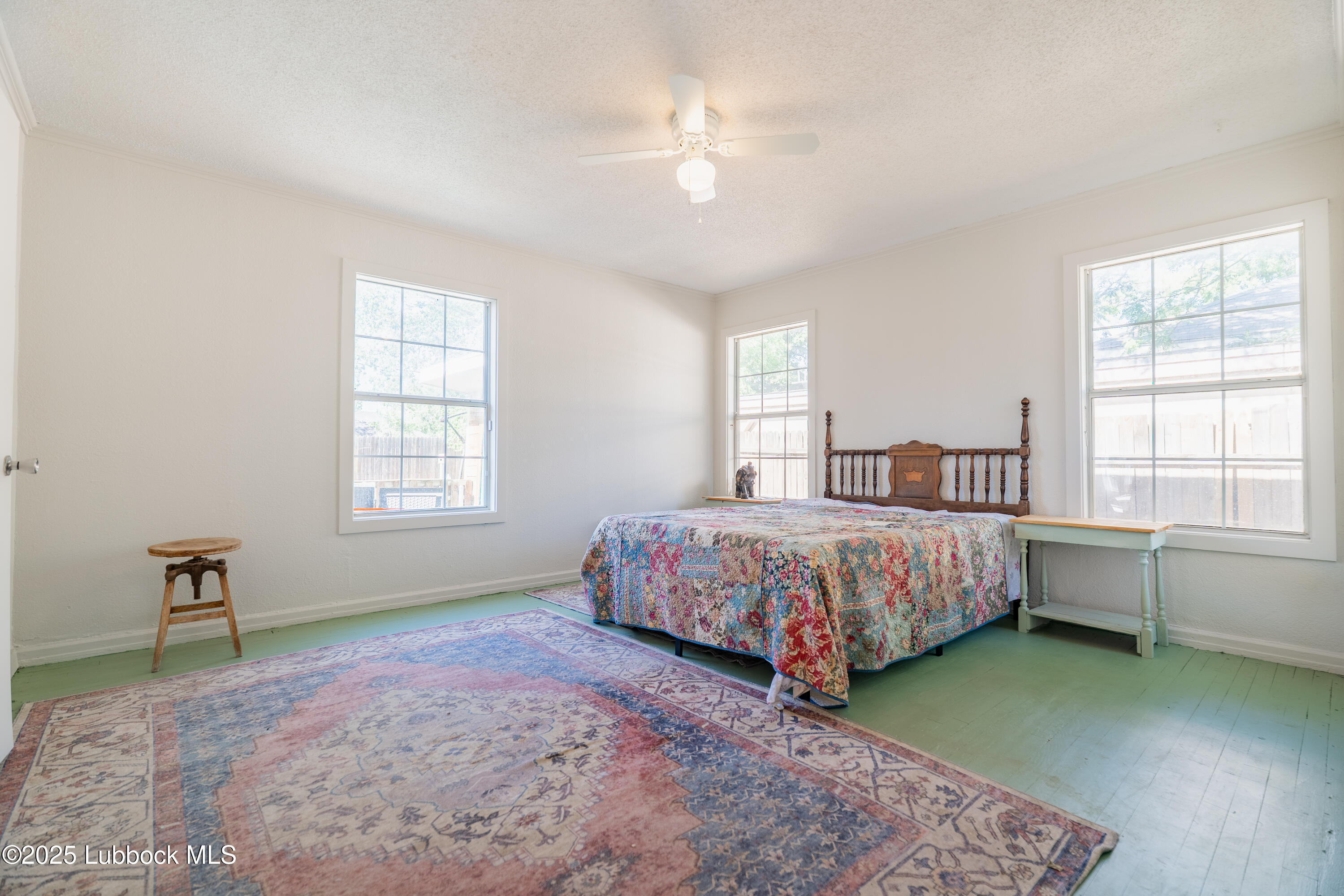 2012 29th Street Lubbock, TX 79411 - Photo 23 of 27 a spacious bedroom with a bed and a window