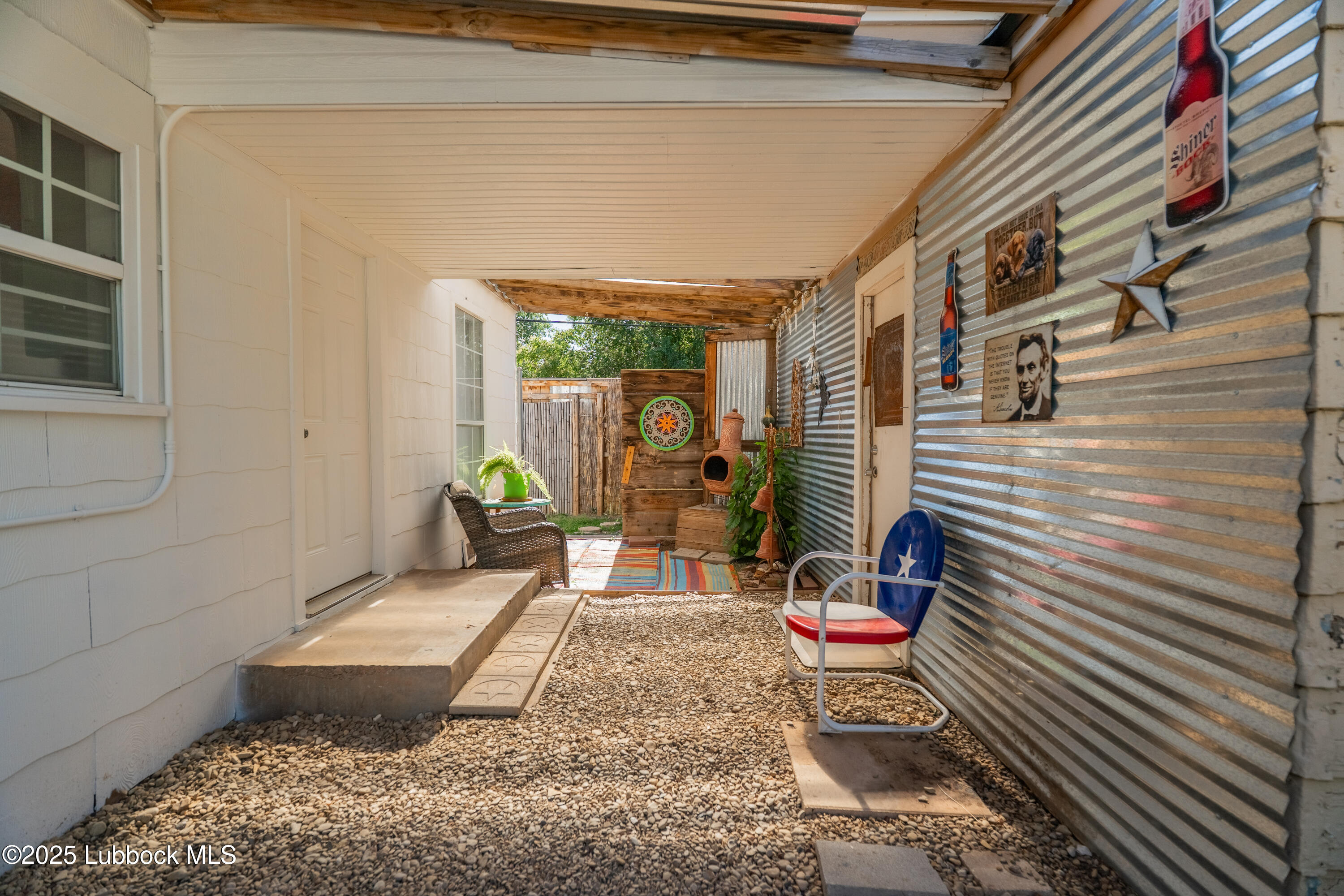 2012 29th Street Lubbock, TX 79411 - Photo 27 of 27 a bench is sitting in middle of the house