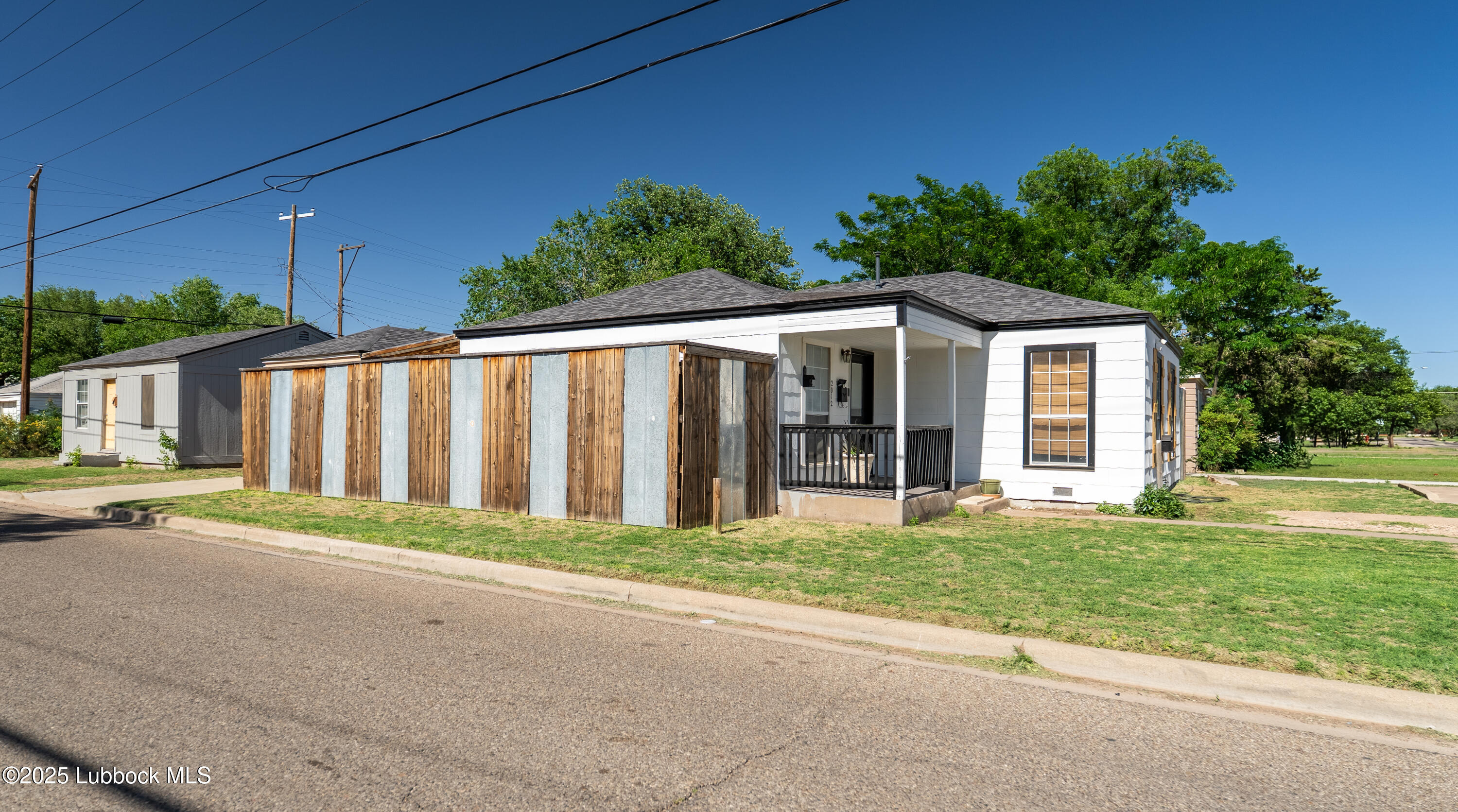 2012 29th Street Lubbock, TX 79411 - Photo 3 of 27 a view of a house with a yard and potted plants