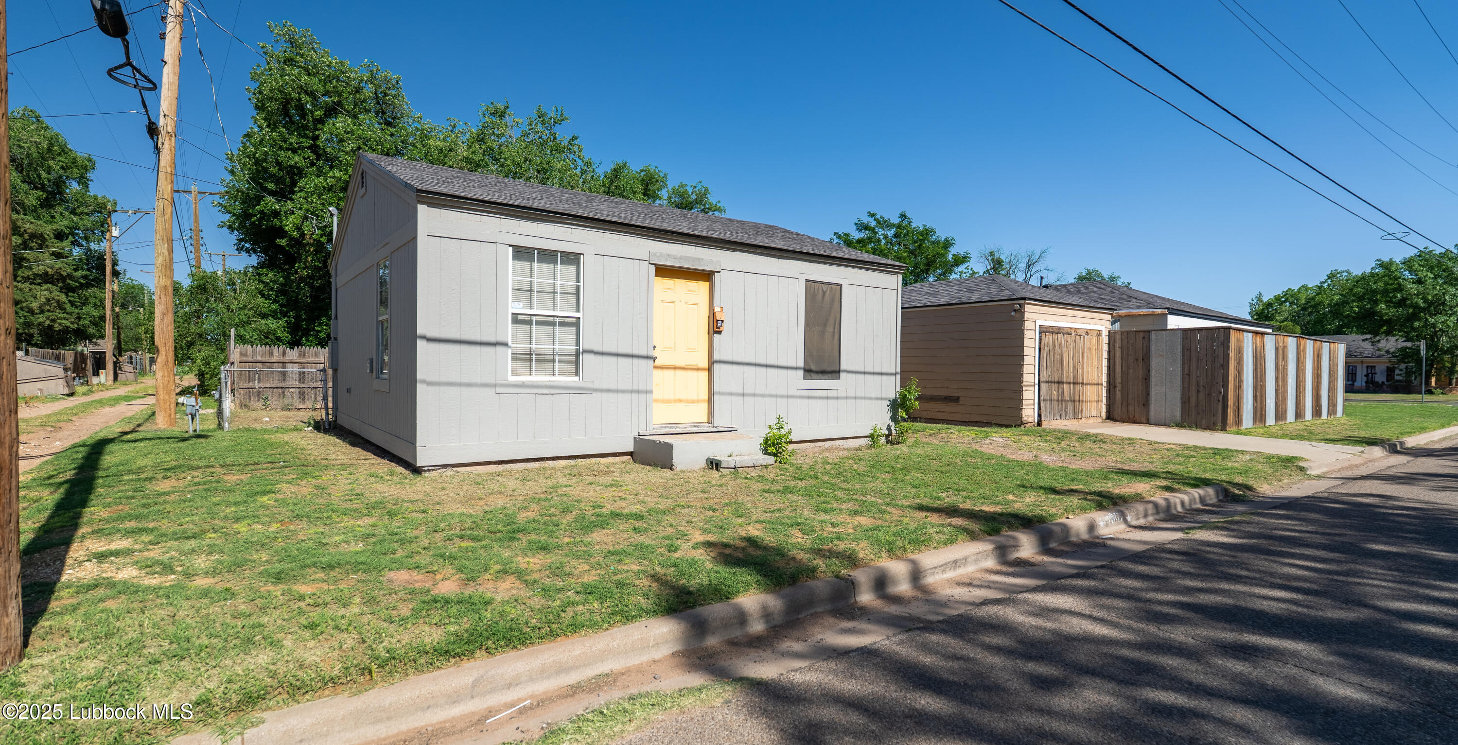 2012 29th Street Lubbock, TX 79411 - Photo 5 of 27 a backyard of a house with barbeque oven and outdoor seating