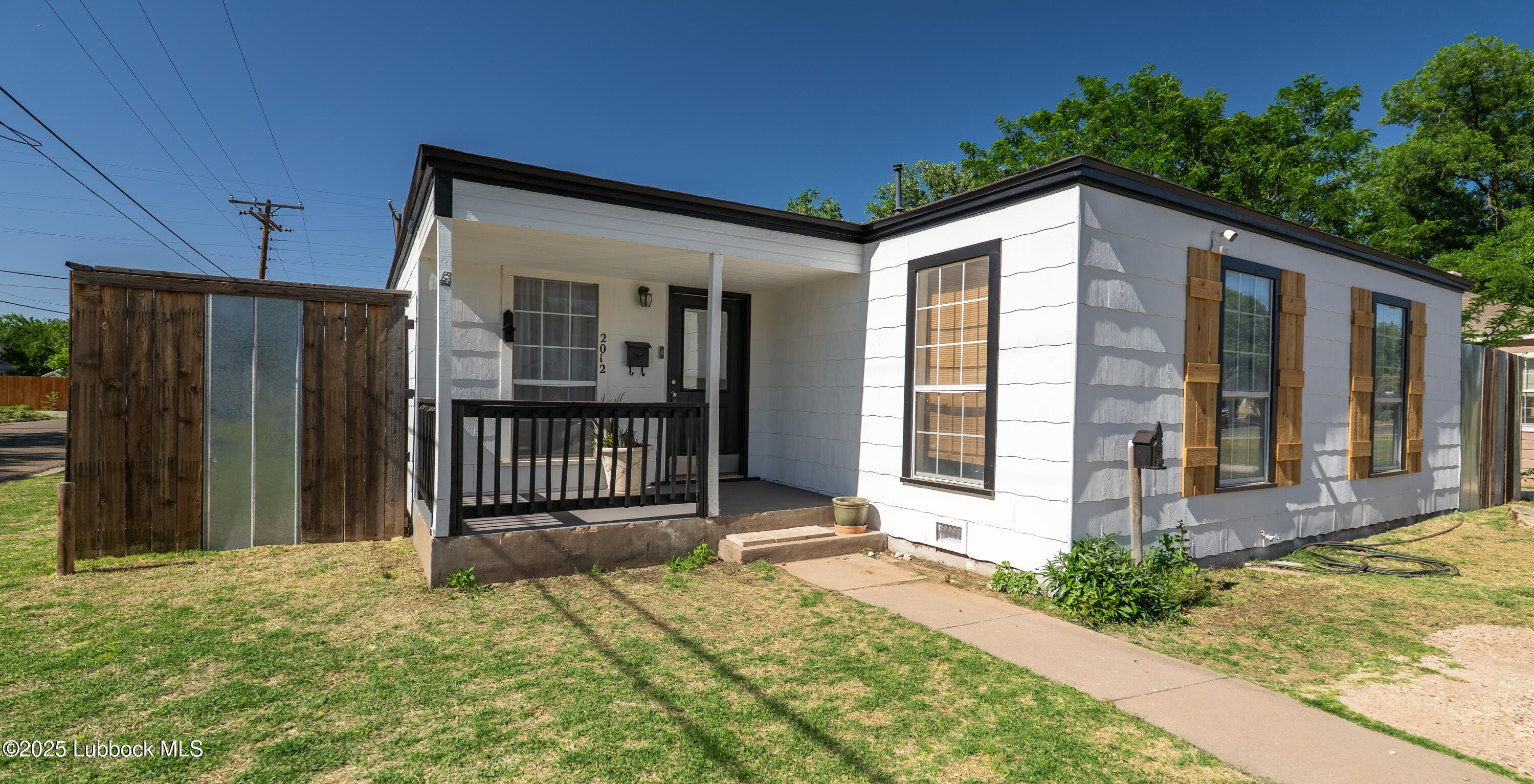 2012 29th Street Lubbock, TX 79411 - Photo 6 of 27 a front view of a house with a yard