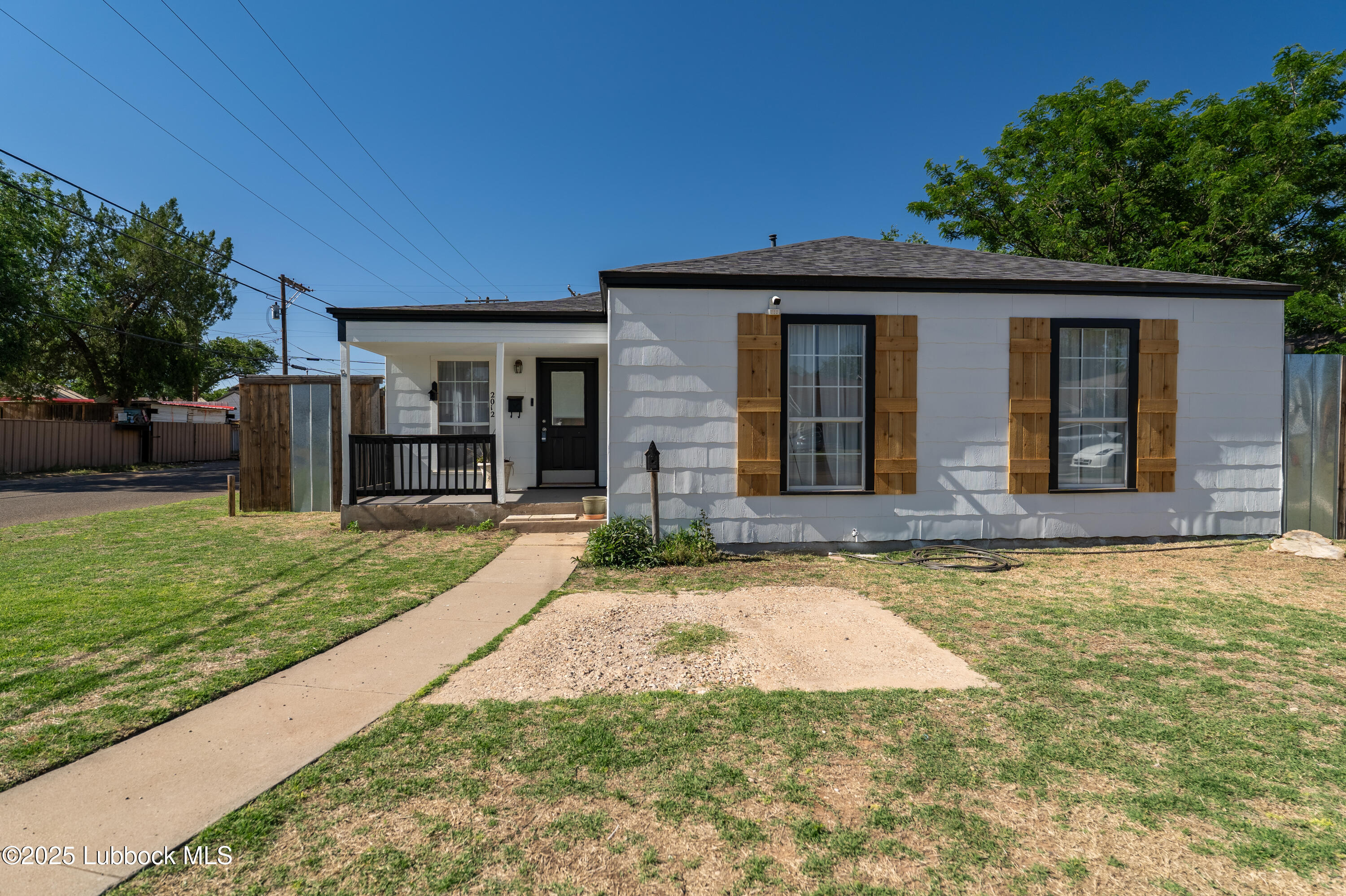 2012 29th Street Lubbock, TX 79411 - Photo 7 of 27 a front view of a house with a yard