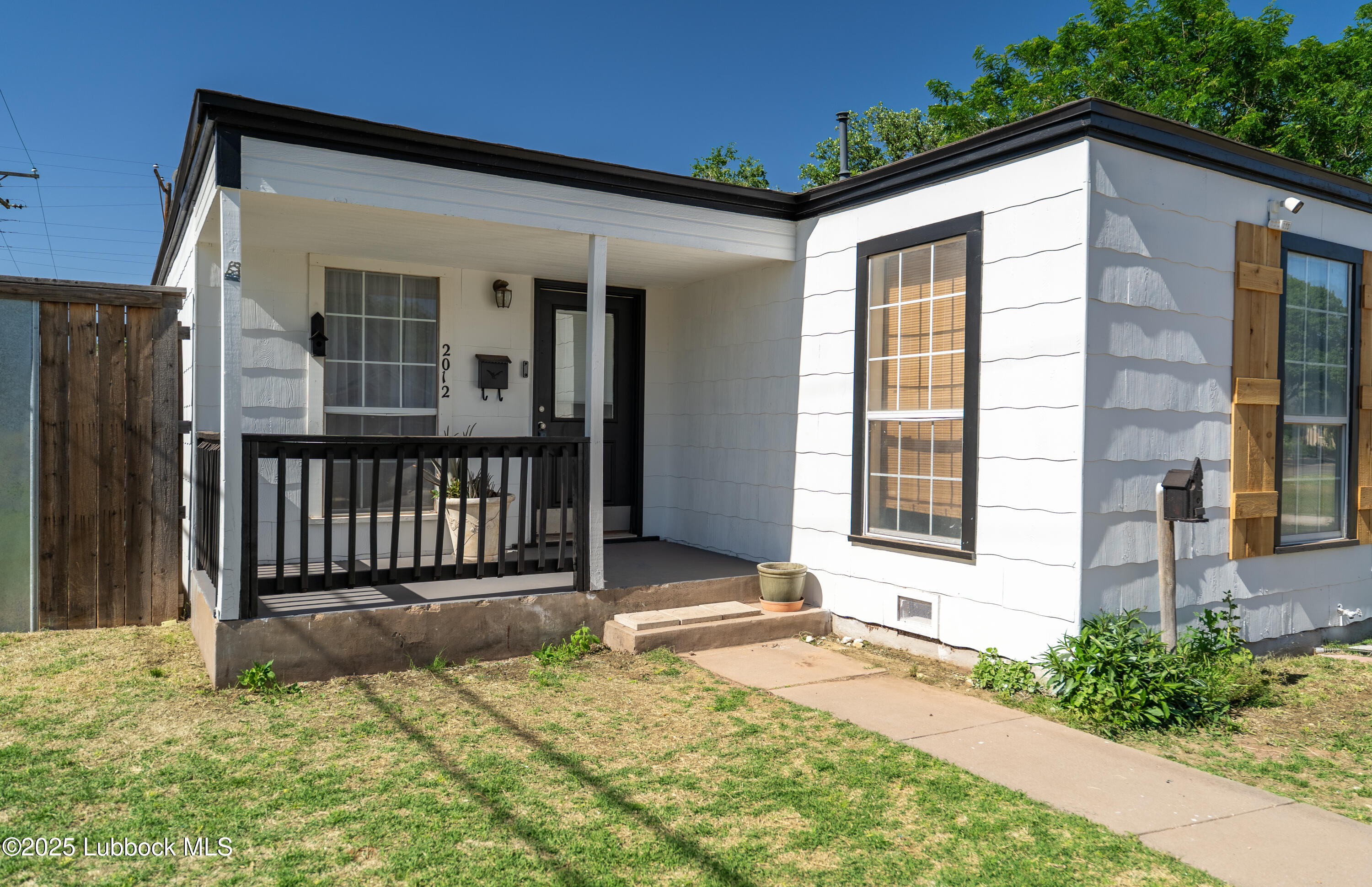 2012 29th Street Lubbock, TX 79411 - Photo 9 of 27 a front view of a house with a outdoor space