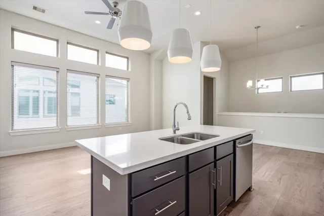 a kitchen that has a lot of cabinets in it