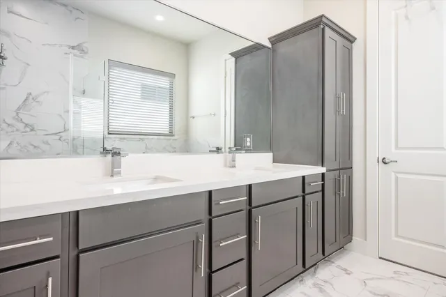 a bathroom with a sink and a mirror