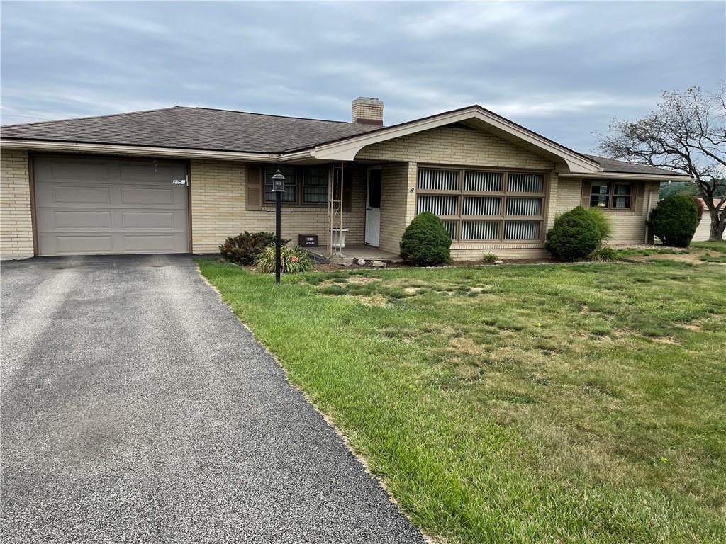 2253 Lazor Street Indiana, PA 15701 - Photo 1 of 24 a front view of a house with garden