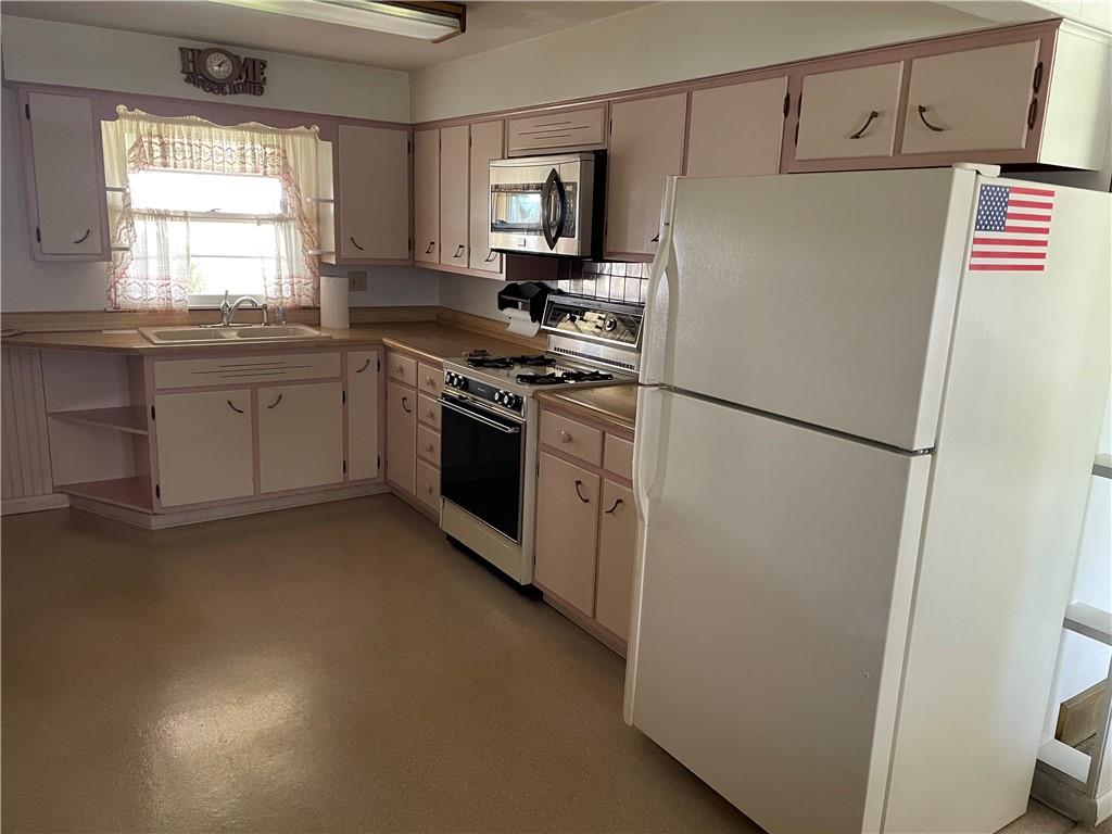 2253 Lazor Street Indiana, PA 15701 - Photo 6 of 24 a kitchen with stainless steel appliances a refrigerator sink and microwave