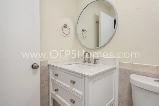 a bathroom with a sink and a mirror