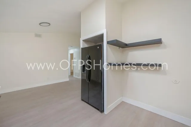 a view of a refrigerator in kitchen