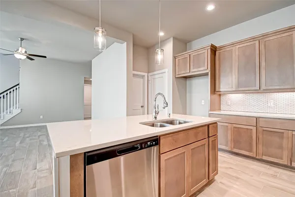a kitchen with a sink a cabinets and window